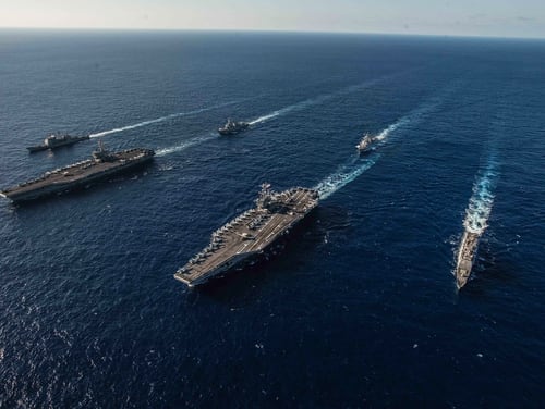 The Ronald Reagan Carrier Strike Group and John C. Stennis Carrier Strike Group sailed the Philippine Sea on Nov. 16 during dual carrier operations. (Navy)