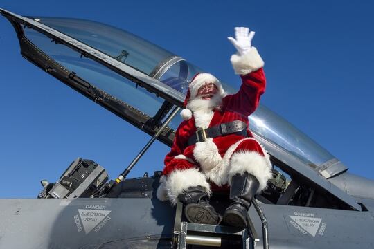 Santa Claus waves as he arrives in a 169th Fighter Wing F-16 Fighting Falcon at McEntire Joint National Guard Base, S.C., Dec. 7, 2019. (Staff Sgt. Megan Floyd/Air National Guard)