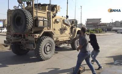 Angry Kurds throw potatoes at American military vehicles