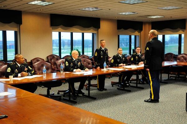 Sgt. Quintin Steeves addresses the 316th Sustainment Command promotion board in December 2014 at the Vernon T. McGarity Army Reserve Center in Coraopolis, Pa. A new Army policy automatically sends all qualified E-4s and E-5s to a local promotion board for consideration. (Master Sgt. D. Keith Johnson/Army)