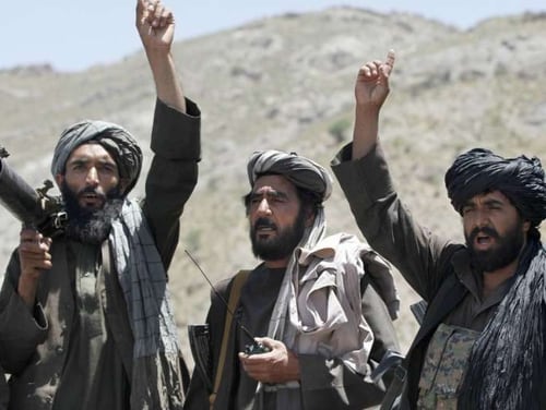 In this May 27, 2016 file photo, Taliban fighters react to a speech by their senior leader in the Shindand district of Herat province, Afghanistan. (Allauddin Khan/AP)