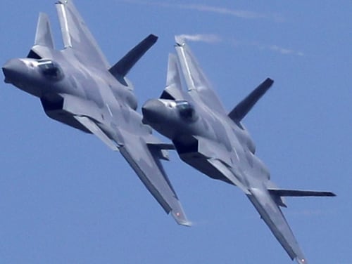 Two J-20 stealth fighter jets of the Chinese People's Liberation Army Air Force perform during the 12th China International Aviation and Aerospace Exhibition, also known as Airshow China 2018, Nov. 6, 2018, in Zhuhai city, Guangdong province. (Kin Cheung/AP)