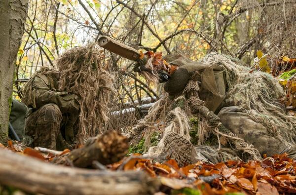 A sniper team prepares to fire while concealed during training at the International Special Training Centre at the Joint Multinational Readiness Center in Hohenfels, Germany. The facility provides advanced training for special operations forces from NATO member-states. (1st Lt. Benjamin Haulenbeek/Army)