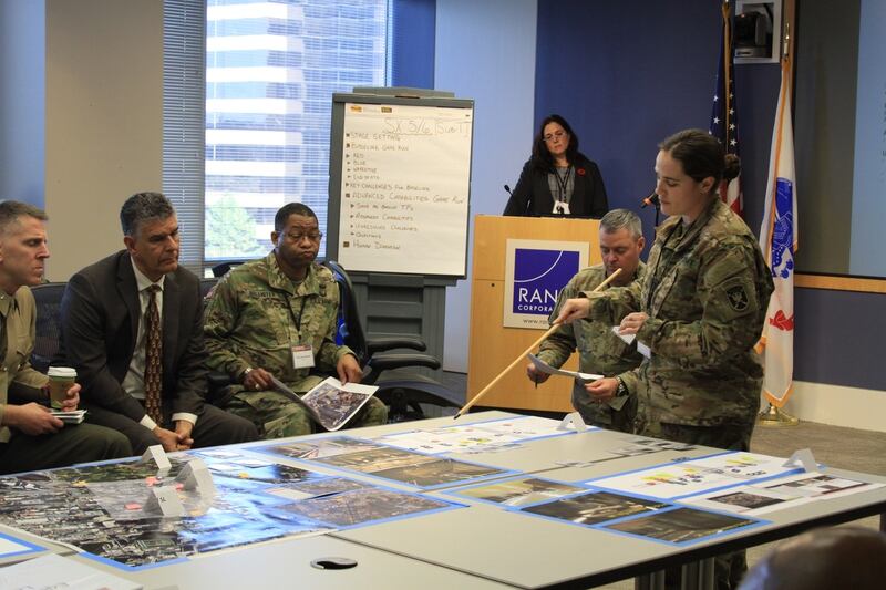 An Army captain who works in psychological operations with U.S. Special Forces conducts a briefing during war game simulations. (Nathan Vest, Rand Corporation)