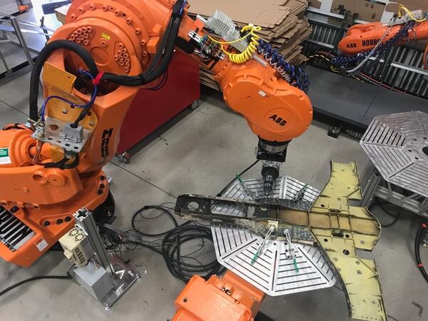 The Strategic Capabilities Office's JARVIS program for the Navy involves machines scanning man-made aircraft parts and then re-producing them more quickly and efficiently. (SC)