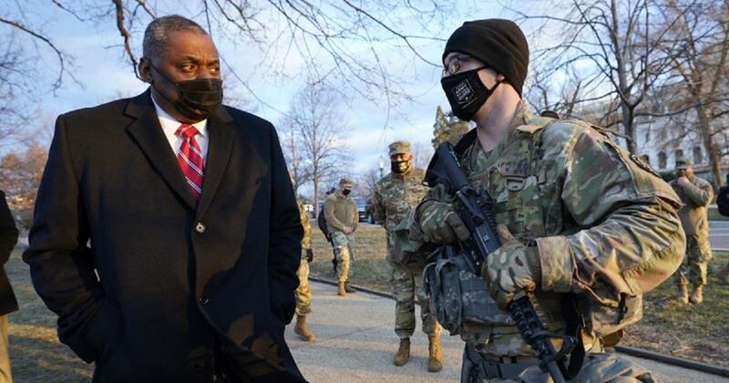Secretary of Defense Lloyd Austin visits National Guard troops deployed at the U.S. Capitol and its perimeter Jan. 29 in Washington. (Manuel Balce Ceneta/AP)