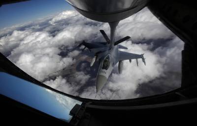 FILE - A U.S. Air Force F-16 refuels in mid-flight from a KC-135 Stratotanker during a Red Flag exercise over The Nevada Test and Training Range on Feb. 10, 2014.