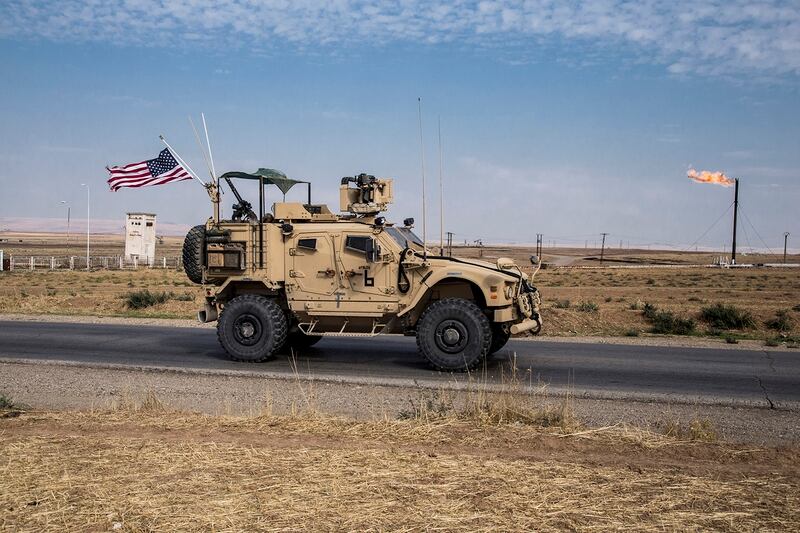 In this Oct. 28, 2019, file photo, U.S. forces patrol Syrian oil fields in eastern Syria. (Baderkhan Ahmad/AP)