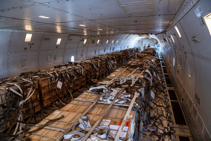 U.S. Airmen from the 60th Airport Squadron load cargo onto a Boeing 757 on January 22, 2022 at Travis Air Force Base, California.  Since 2014, the United States has committed more than $5.4 billion in total assistance to Ukraine, including security and non-security assistance.  The United States reaffirms its unwavering commitment to Ukraine's sovereignty and territorial integrity in support of a secure and prosperous Ukraine.  (Nicholas Pilch/Air Force)