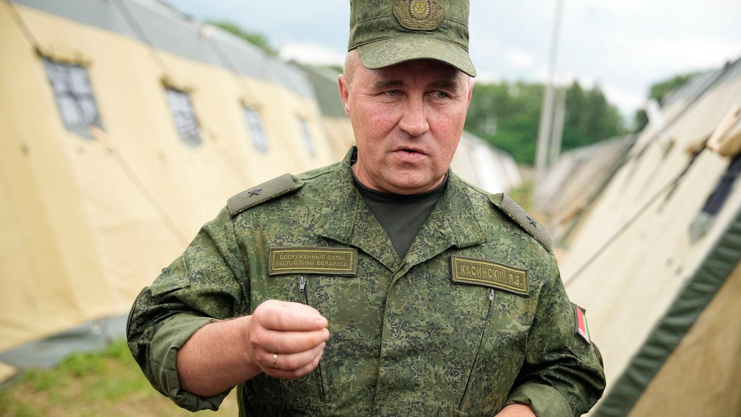 Maj. Gen. Leonid Kosinsky speaks to journalists in the Belarusian camp. The officer is an assistant to the country's defense minister. (Alexander Zemlianichenko/AP)