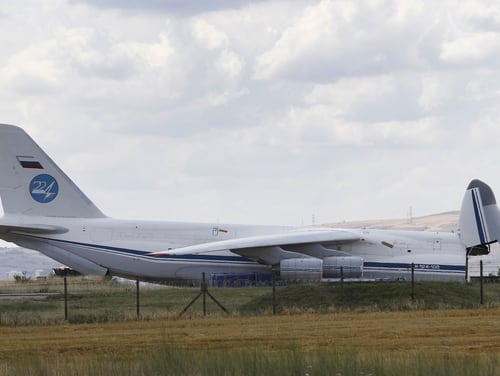 A Russian transport aircraft, reportedly carrying parts of the S-400 air defense systems, is seen on the tarmac after it landed at Murted military airport in Ankara, Turkey, Friday, July 12, 2019. The first shipment of a Russian missile defense system has arrived in Turkey, the Turkish Defense Ministry said Friday.(DHA via AP)