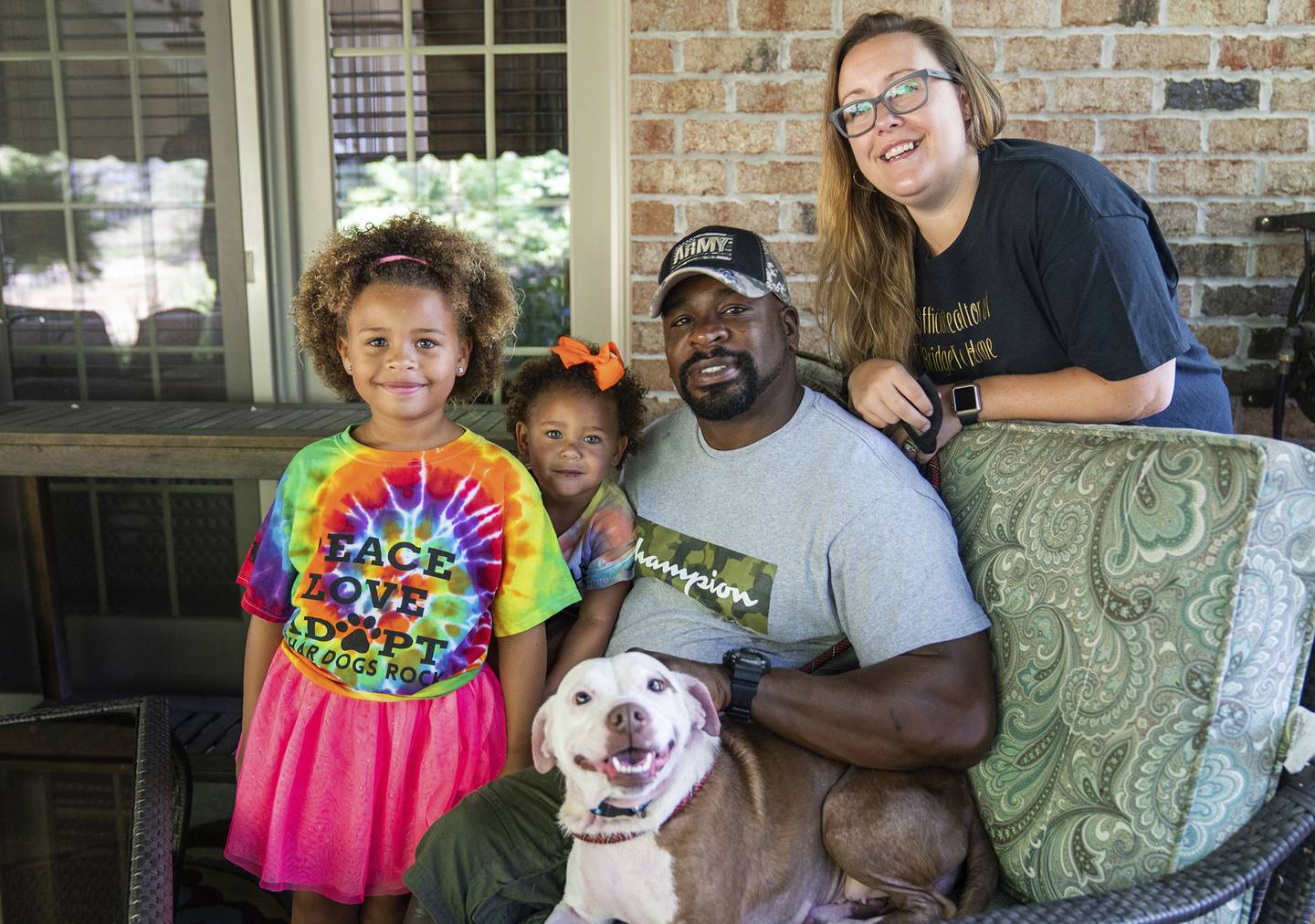 From left, Zaida Brooks, 5, Waverly Brooks, 2, their father, Omar Brooks, and mother, Nicole Malesic, pose for a photo with Maisie Mae, a foster dog at Bridge To Home Animal Rescue on Monday, July 6, 2020, in Eighty Four, Pa.