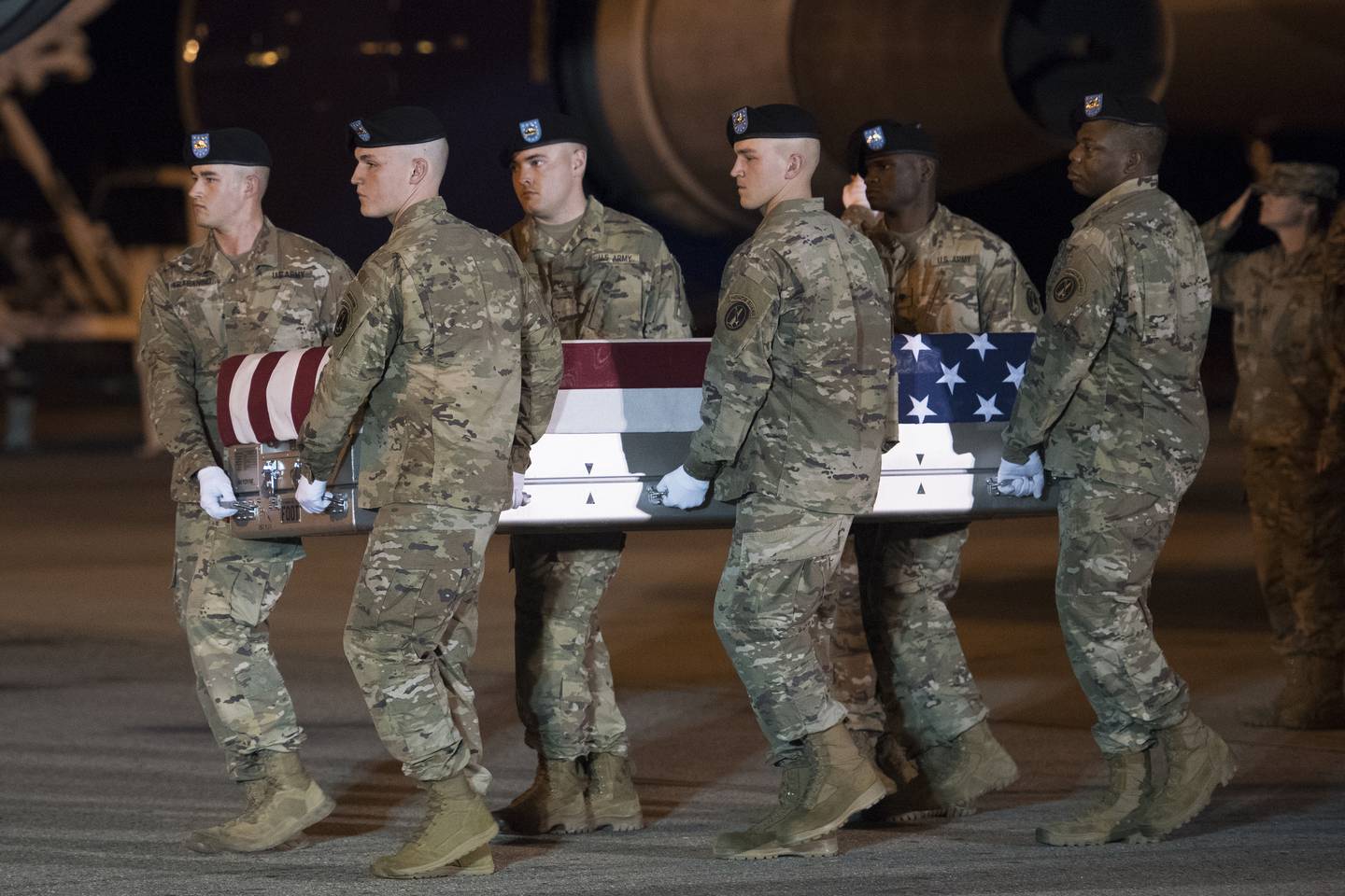 An Army carry team moves a transfer case containing the remains of Sgt. 1st Class Elis Barreto Ortiz, 34, from Morovis, Puerto Rico, Saturday, Sept. 7, 2019, at Dover Air Force Base, Del.