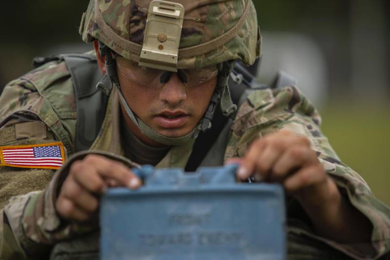 Sgt. Jose Galva Diaz sets up a training M18 Claymore Mine on a multi-event simulation lane during the 2020 U.S. Army Reserve Best Warrior Competition at Fort McCoy, Wis., Sept. 6, 2020.