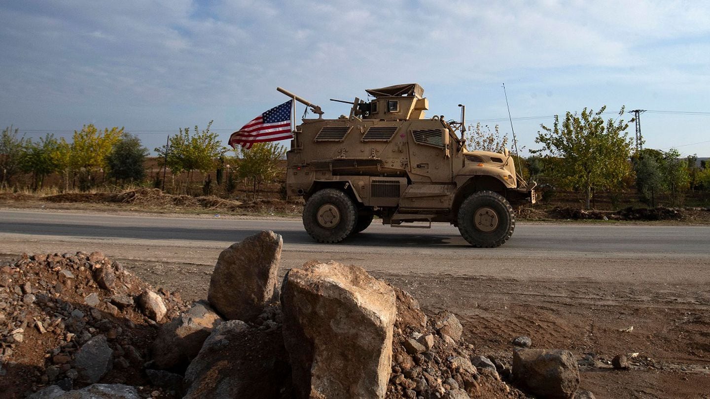 U.S. forces patrol near the countryside of Rumaylan (Rmeilan) in Syria's northeastern Hasakeh province near the Turkish border, on December 2, 2022. (Delil Souleiman/AFP via Getty Images)