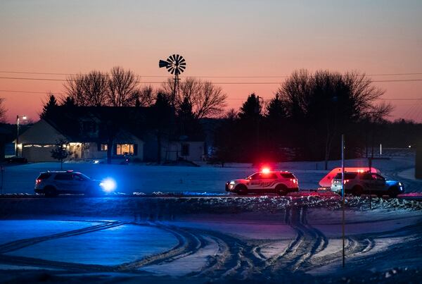Police block off a road leading to the scene of a Black Hawk helicopter that crashed in the woods neat Marty, Minn., Dec. 5. (Renee Jones Schneider/Star Tribune via AP)