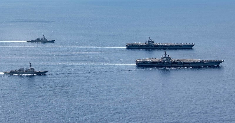 The Ronald Reagan and Nimitz Carrier Strike groups steam in formation in the South China Sea July 6. (MC3 Jason Tarleton)