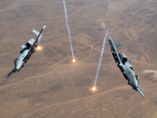 Two U.S. Air Force A-10 Thunderbolt IIs release countermeasure flares over the U.S. Central Command area of responsibility, July 23, 2020. (Staff Sgt. Justin Parsons/Air Force)