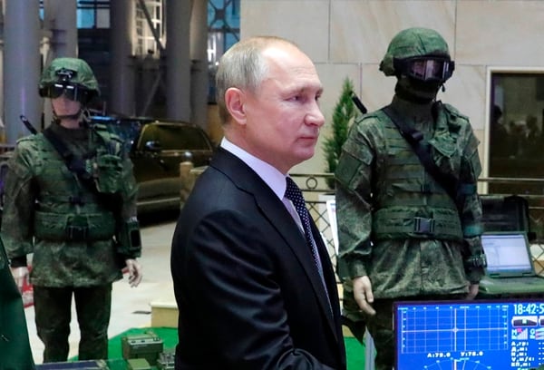 Russian President Vladimir Putin arrives to attend an annual meeting with top military officials in the National Defense Control Center in Moscow on Dec. 24, 2019. (Mikhail Klimentyev/Sputnik, Kremlin Pool Photo via AP)