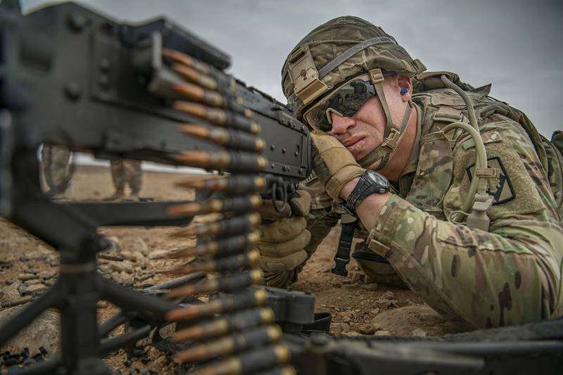 Staff Sgt. Dakota Montgomery fires an M240 machine gun during a weapon familiarization range on Nov. 28, 2020, while deployed to the Middle East in support of Operation Spartan Shield and Operation Inherent Resolve.