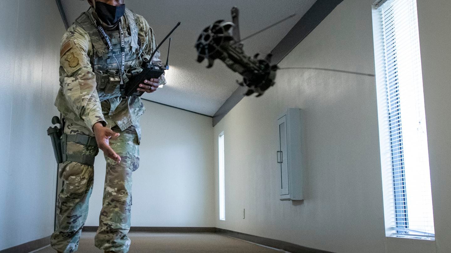 Staff Sgt. Daniel Turnley-Butts tosses a Throwbot during a demonstration Aug. 5, 2020, at Eglin Air Force Base, Fla. (Samuel King Jr./US. Air Force)