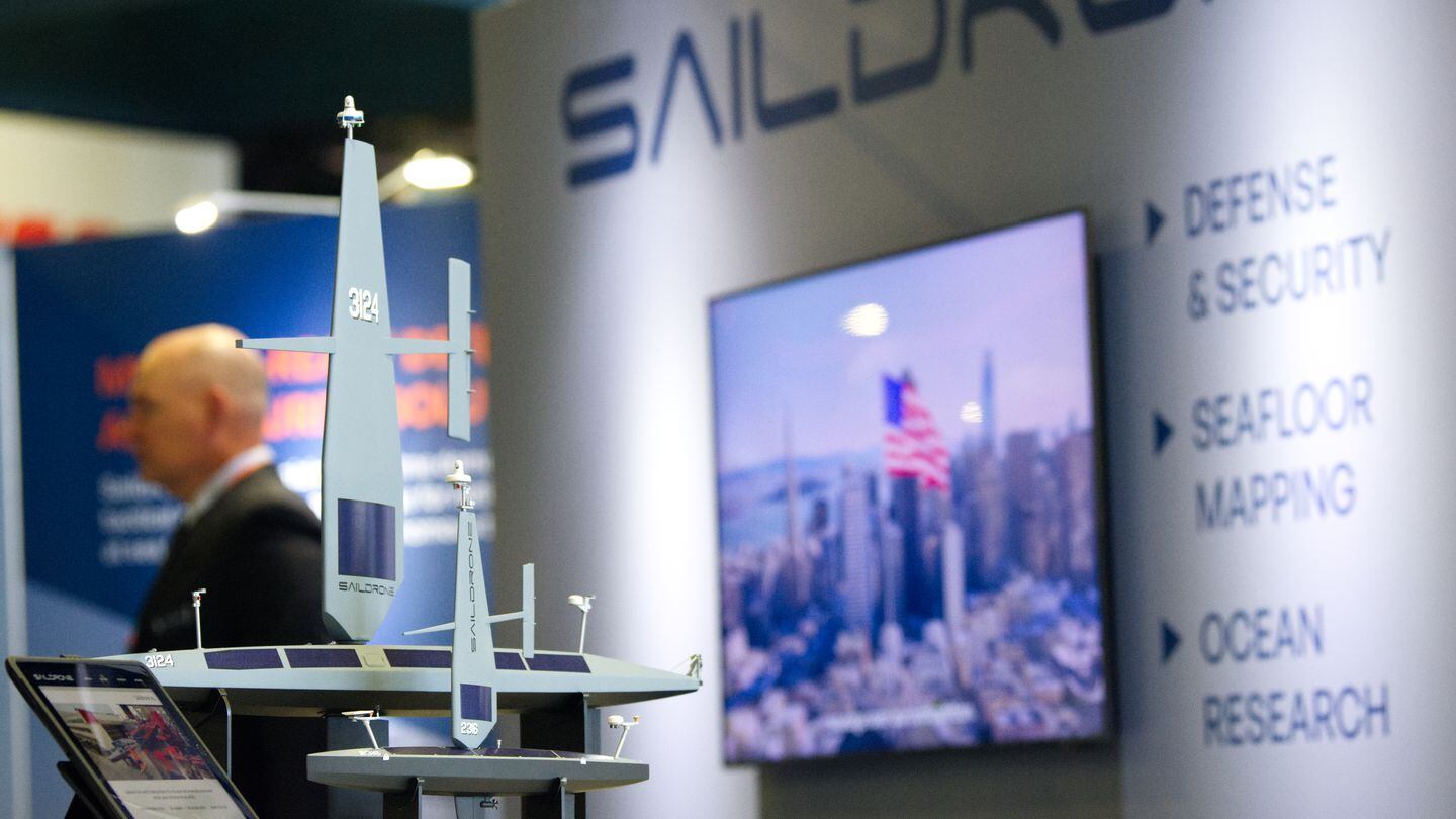 Models of Saildrone unmanned surface vessels are seen at the company's booth April 8, 2024. Saildrone is collaborating with Thales Australia on anti-submarine warfare technologies. (Colin Demarest/C4ISRNET)