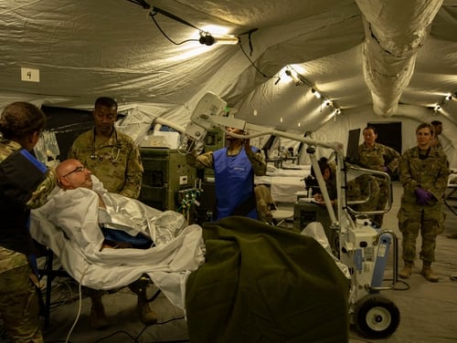 Soldiers assigned to the 531st Hospital Center prepare a simulated patient for x-rays in their intensive care unit on Oct. 26, 2019. (Army)
