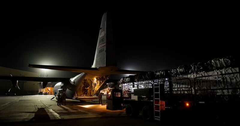 A C-130J Super Hercules and its aircrew assigned to the 746th Expeditionary Airlift Squadron from Al Udeid Air Base, Qatar, loads cargo destined for an undisclosed location in Afghansitan, May 5. (Senior Airman Xavier Navarro/Air Force)