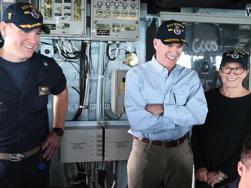 Cmdr. Jeffrey Tamulevich, then-commanding officer of the guided-missile destroyer Hopper, shows Navy Secretary Richard Spencer and his wife, Sarah Pauline Spencer, the ship’s bridge on Thanksgiving Day in 2017. (Navy)