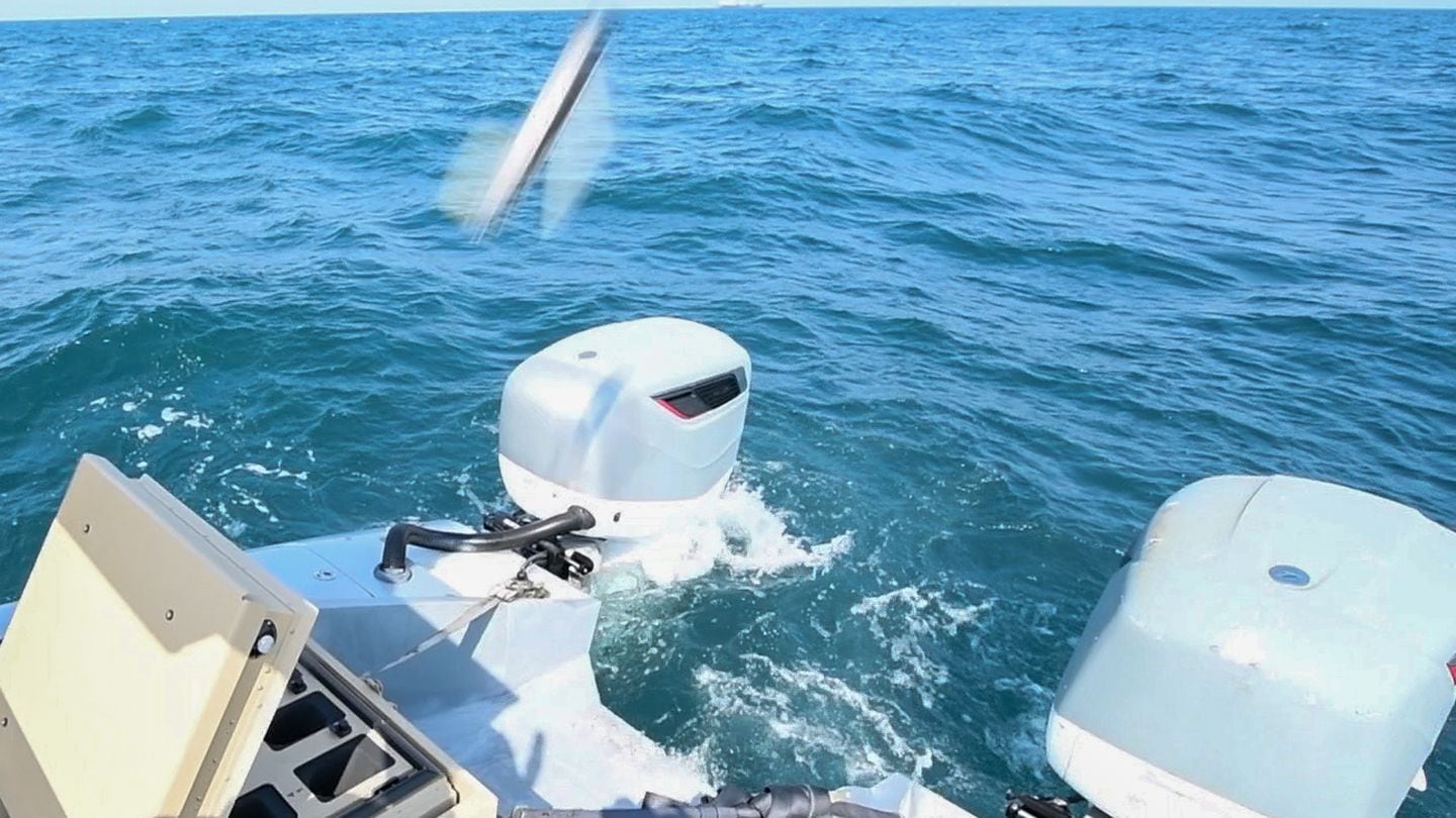 A surface drone uses a missile system to destroy a target boat in testing off the Arabian Peninsula in 2023. (Chief Mass Communication Specialist Justin Stumberg/U.S. Navy)