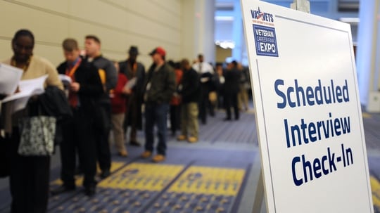 Veterans wait in line at a federal career fair in Washington in January 2012. (Department of Veterans Affairs)