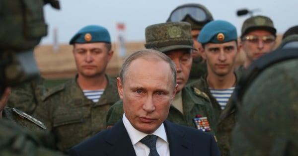 Russian President Vladimir Putin talks to officers during a visit to military exercises at Donguzsky Range in Orenburg, Russia, in September 2015. (Sasha Mordovets/Getty Images)