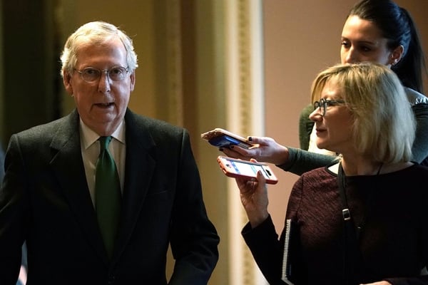 U.S. Senate Majority Leader Mitch McConnel walks toward the Senate chamber W3ednesday. Sen. McConnell and Senate Minority Leader Chuck Schumer announced that they have reach agreement on a two-year budget deal. (Alex Wong/Getty Images)