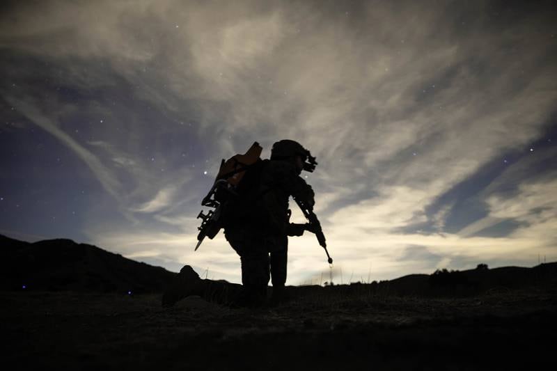 U.S. Marine Corps Lance Cpl. Michael Wick provides security during a Tactical Recovery of Aircraft and Personnel (TRAP) exercise at Marine Corps Base Camp Pendleton, Calif., Dec. 16, 2020.