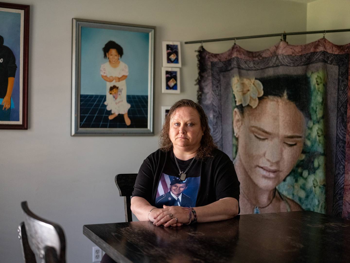 Nicole Graham poses for a portrait in her home, where she has several shrines dedicated to her daughter Asia, who died almost exactly one year to the day after Alvarado assauted her.