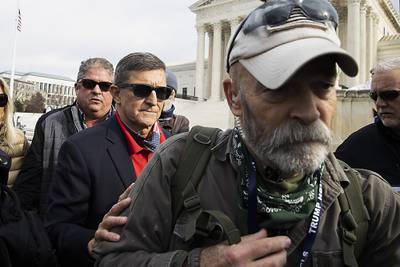 Retired Lt. Gen. Michael Flynn, President Donald Trump’s recently pardoned national security adviser, departs a protest of the outcome of the 2020 presidential election outside the Supreme Court on Dec. 12, 2020 in Washington.