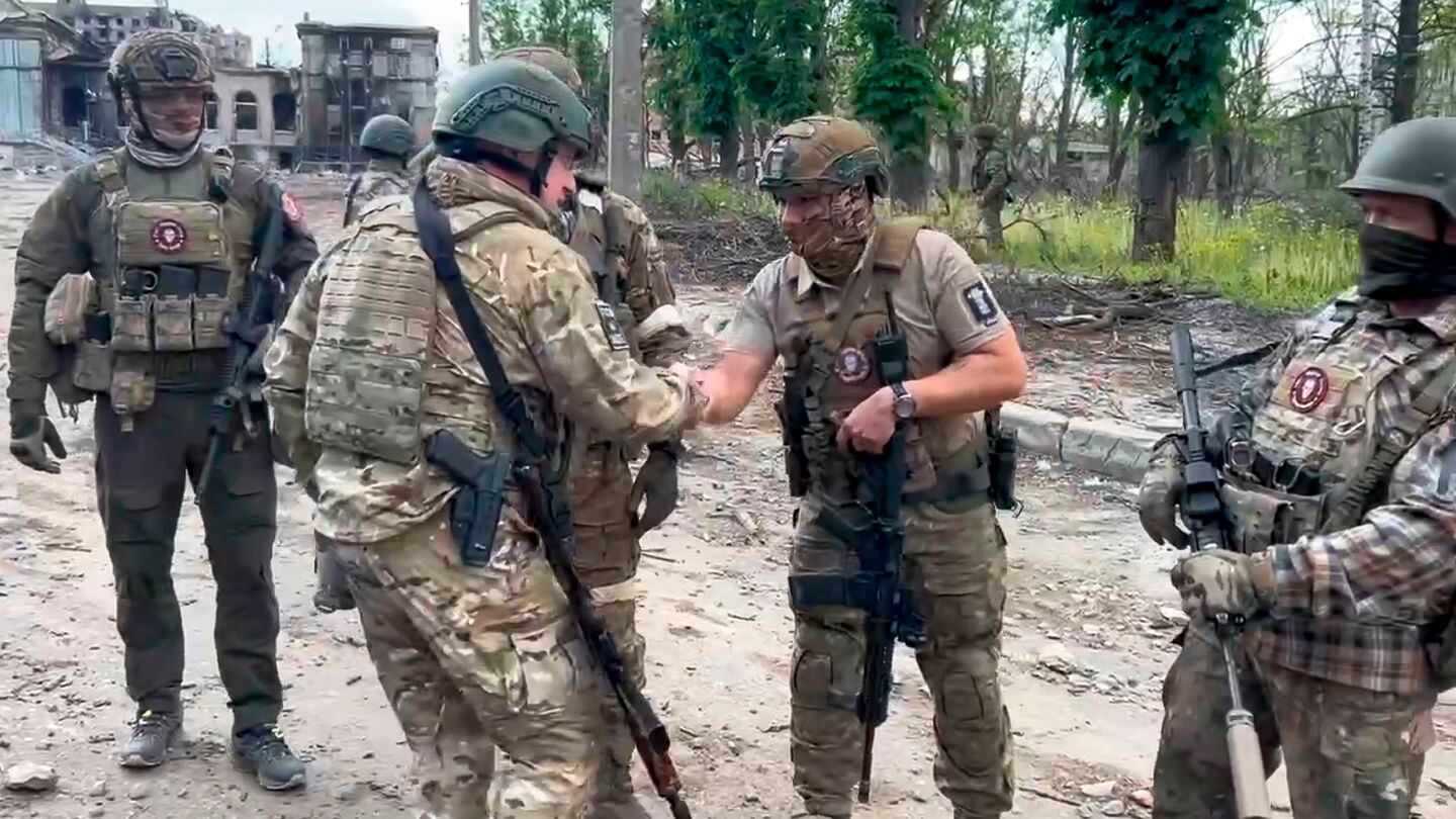 In this grab taken from video released by Prigozhin Press Service on Saturday, May 20, 2023, Yevgeny Prigozhin, the owner of the Wagner Group military company shakes hands with his soldiers, in Bakhmut, Ukraine. (Prigozhin Press Service via AP)