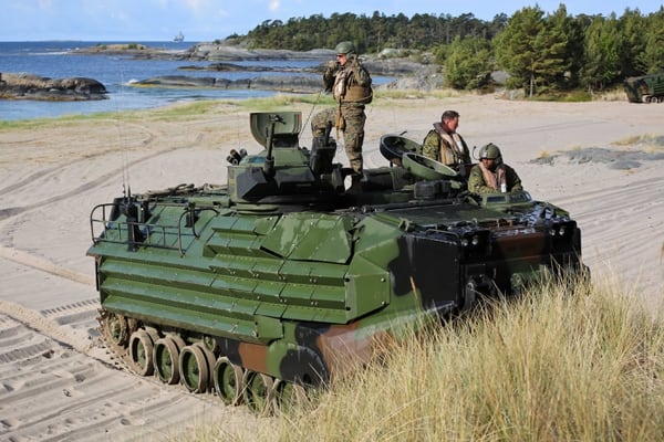 U.S. Marines communicate with other amphibious assault vehicles during BALTOPS, an annual multinational exercise designed to improve interoperability, enhance flexibility, and demonstrate the resolve of allied and partner nations to defend the Baltic region. (MC1 America A. Henry/U.S. Navy)
