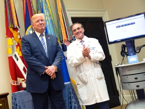 President Donald Trump listens to applause with then Veterans Affairs Secretary Dr. David Shulkin during a presentation at the White House on Aug. 3, 2017. (Chris Kleponis/Getty Images)