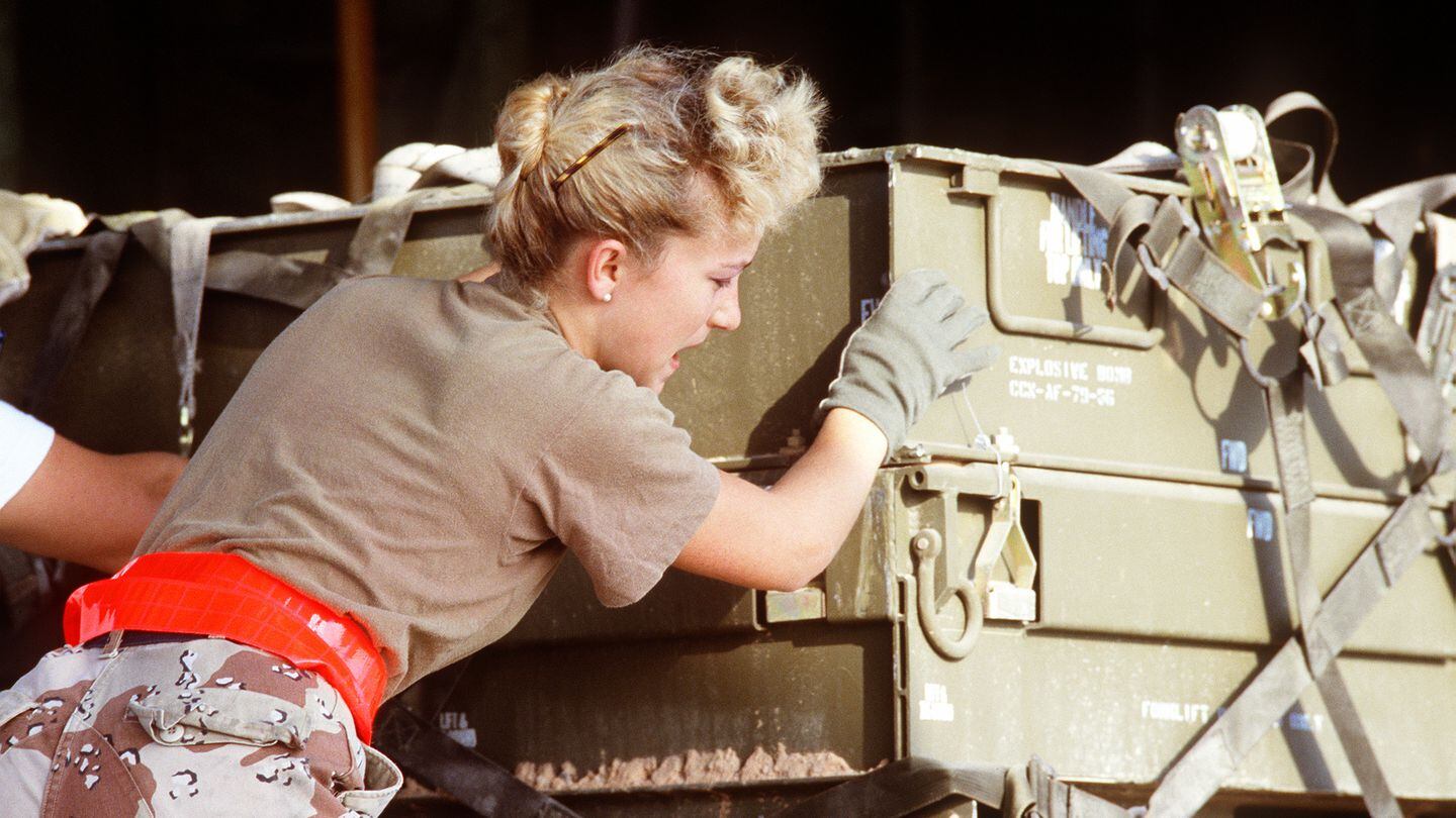 An airman helps to move ordnance containers during Operation Desert Storm. (National Archives and Records Administration)