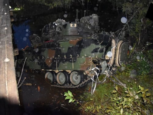 An M2A3 Bradley is pulled from a creek after flipping over a bridge at Fort Stewart, Georgia, on Oct. 20, 2019. (Army/FOIA)