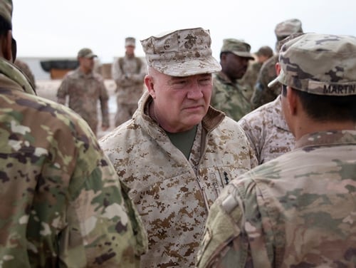 Marine Corps Gen. Kenneth McKenzie, the commander of U.S. Central Command, center, visits airmen assigned to the 332 Air Expeditionary Wing, Jan. 24, 2020, at an undisclosed location. (Staff Sgt. Alexandria Brun/Air Force)