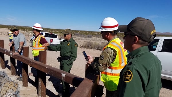 USACE engineers and Border Patrol agents discuss replacement of existing vehicle barriers with pedestrian border wall fencing near Columbus, N.M., on March 29, 2019. (Dave Palmer/Army Corps of Engineers)