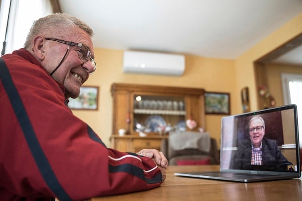 In this photo taken May 8, 2019, Andre Gantois in Ludres, France, talks to his half-brother Allen Henderson, of Greenvile, S.C., during a video-conference. Gantois, the son of an American serviceman who served in France during World War II, recently discovered his half-brother thanks to DNA testing. (Jean-Francois Badias/AP)