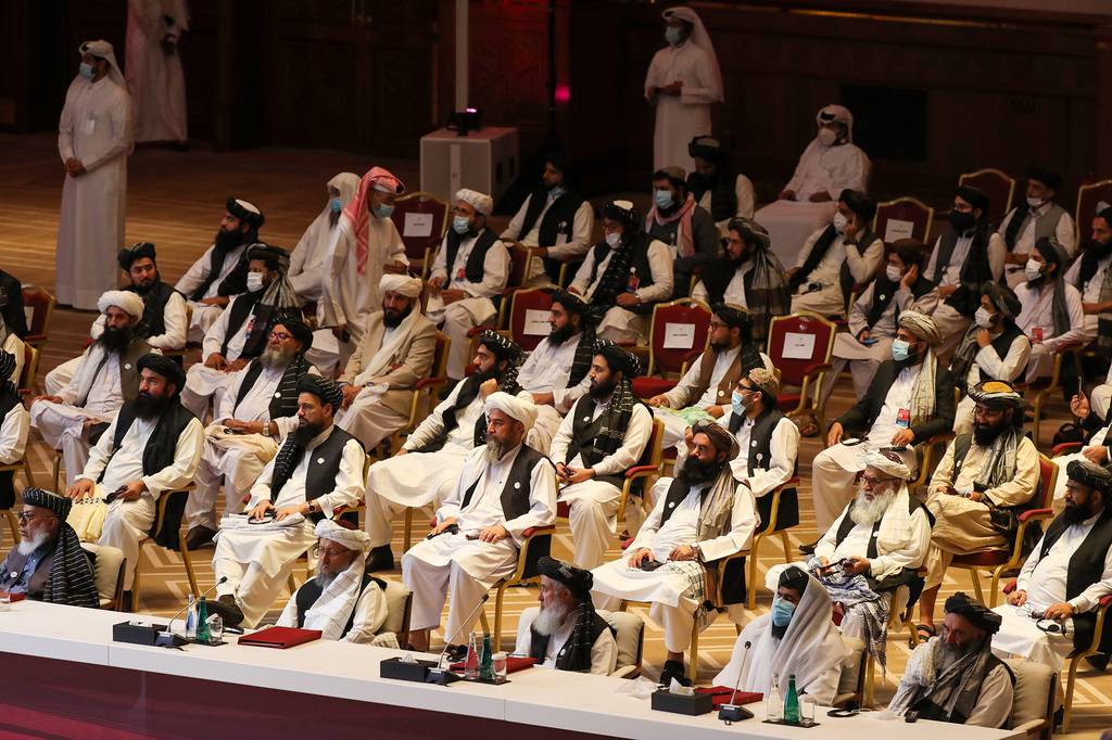 Members of the Taliban delegation attend the opening session of the peace talks between the Afghan government and the Taliban in the Qatari capital Doha on Sept. 12, 2020.