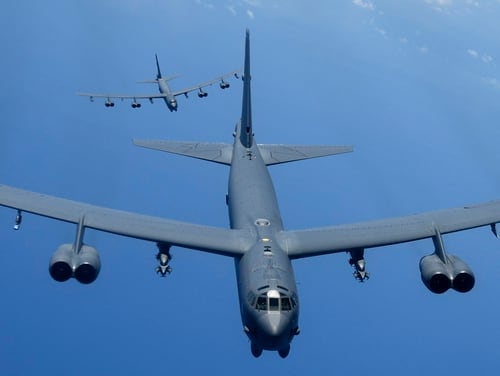 Two U.S. Air Force B-52H Stratofortress bombers fly over the Pacific Ocean during a routine training mission Aug. 2. (A1C Gerald R. Willis/ Air Force)