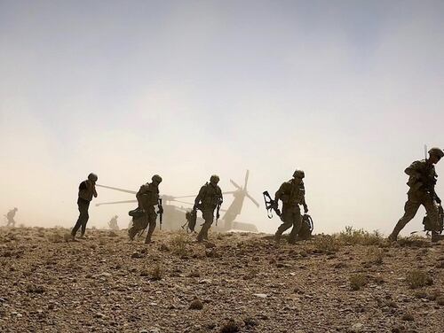 Soldiers from Eagle Troop, 2nd Squadron, 1st Calvary Regiment, 1st Stryker Brigade Combat Team, 4th Infantry Division dismount a UH-60 Black Hawk in preparation for a foot patrol in Afghanistan, Sept. 4, 2018.