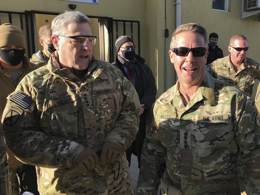 Chairman of the U.S. Joint Chiefs of Staff Gen. Mark Milley, left, talks with Gen. Scott Miller, the commander of U.S. and coalition forces in Afghanistan, Wednesday, Dec. 16, 2020 at Miller’s military headquarters in Kabul, Afghanistan.