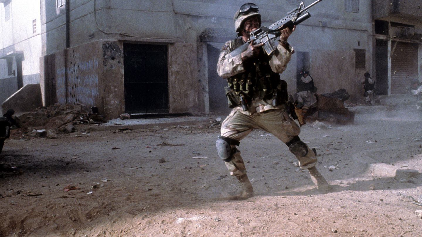 A military man in combat in a scene from the 2001 film 
