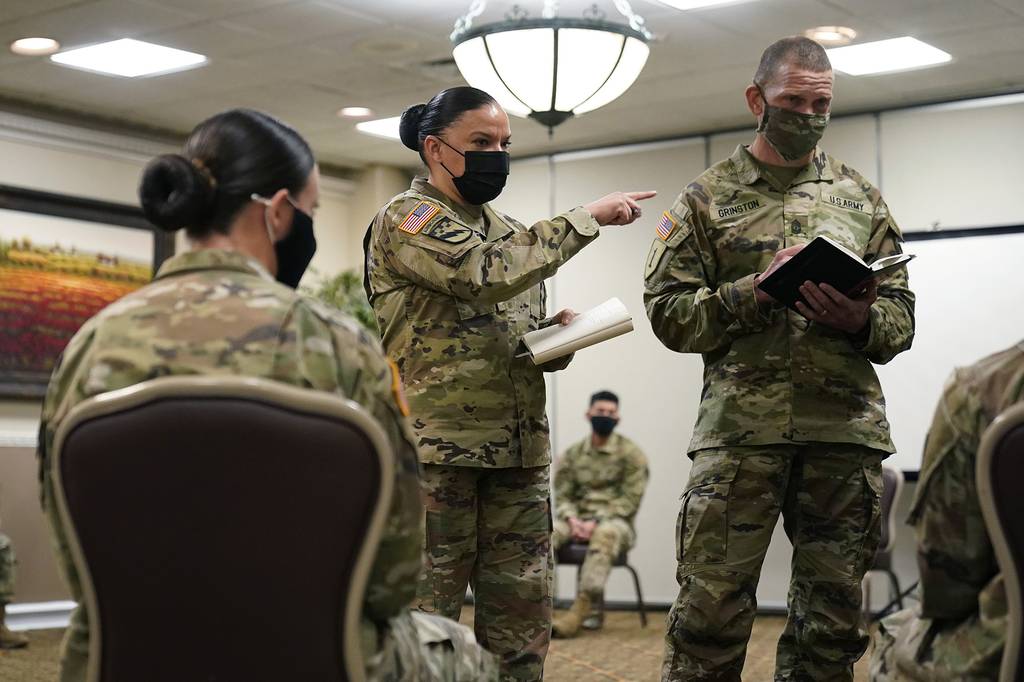 Soldiers give feedback to and Sgt. Maj. Julie Guerra, People First Task Force, center, and Sergeant Major of the Army Michael Grinston, right, about their concerns at Fort Hood, Texas, Thursday, Jan. 7, 2021.